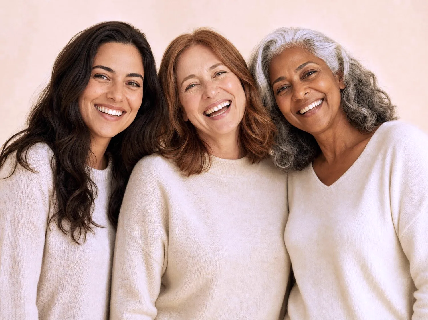 Three women of different ages, smiling together
