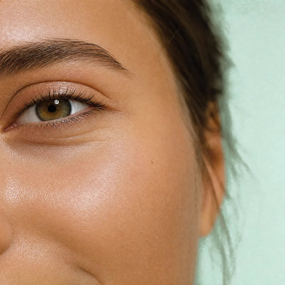 Close-up of smooth, radiant skin around the eye — what Stella+ is built for